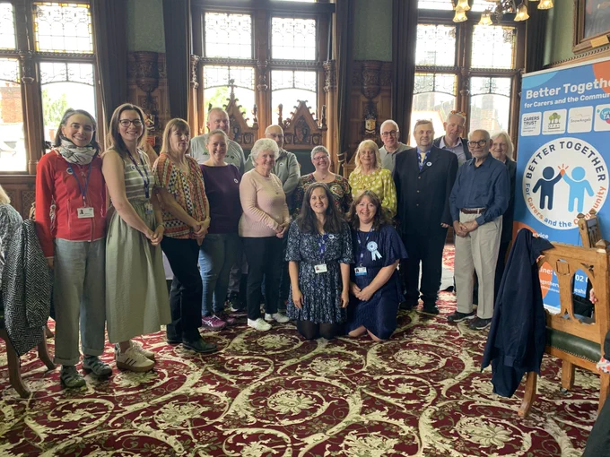 The Lord Mayor posing for a photograph in the Council Chamber at Chester Town Hall