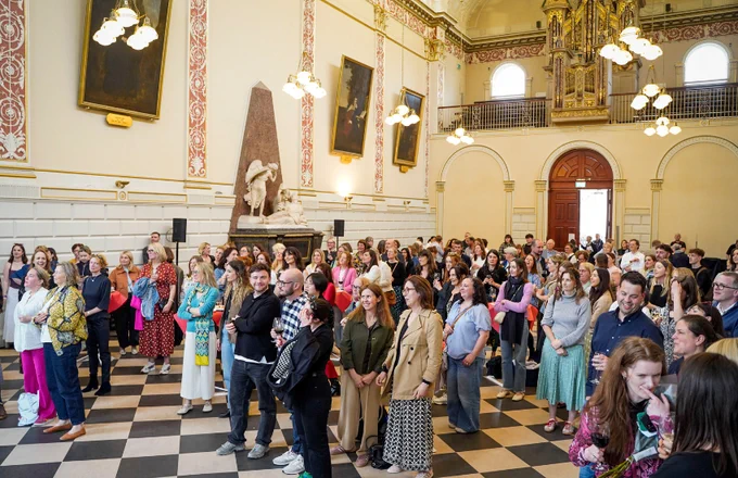 Alumni of the School attending the Languages Alumni Summer Social in the Exam Hall, Trinity College Dublin.