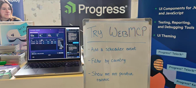 Try WebMCP written on a white board with a laptop next to it showing a demo