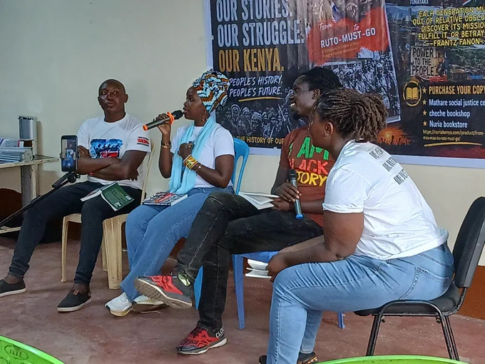 Human Rights Activist and co-author Wanjira Wanjiru (second left) of From MauMau to Ruto Must Go, during a panel discussion with colleagues during launch at Ghetto Foundation Social Hall, Mathare on June 12, 2026/JFJ