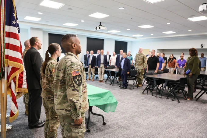 During the Army 251st cake cutting ceremony, all stand for the playing of the Army Song.