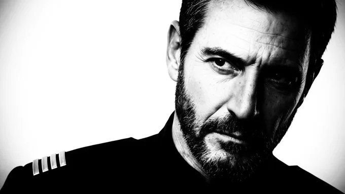 The captain in black and white.