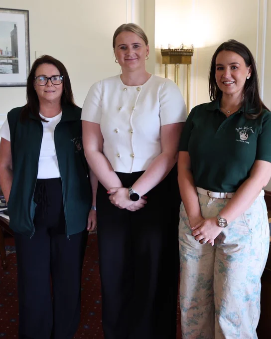 Image of three people, including Junior Minister Aisling Reilly (centre)