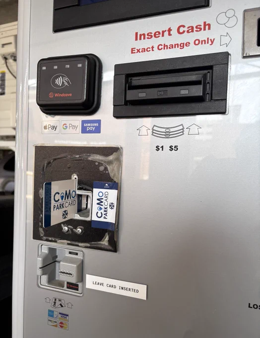A CoMo Park Card in a parking garage payment slot.
