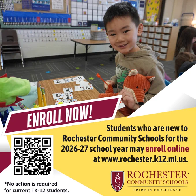 Young student in a classroom working with number cards at a table, surrounded by educational materials and colorful decor.