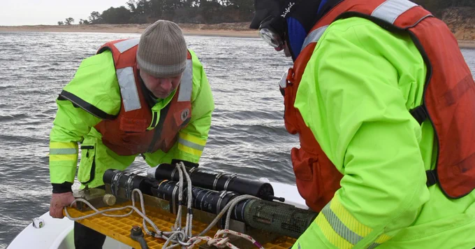 USGS staff prepare to drop a current meter overboard from the research boat, Muddy Waters, offshore of Wellfleet, Massachusetts.