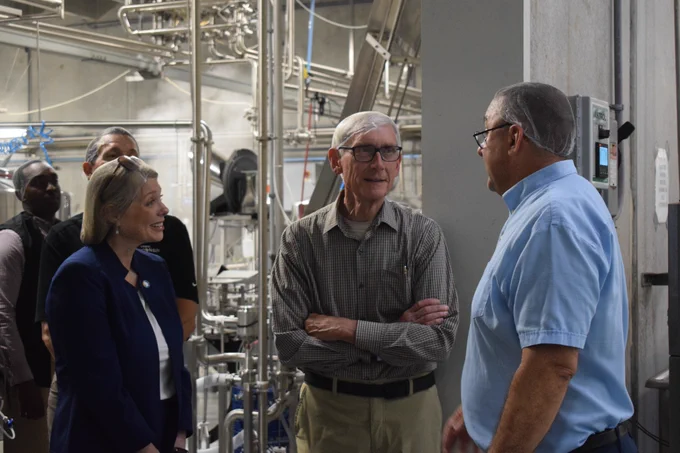 Gov. Evers and Sec. Sayers tour production facility with owner, Mark 