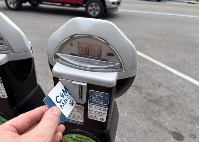 A CoMo Park Card in a meter slot.