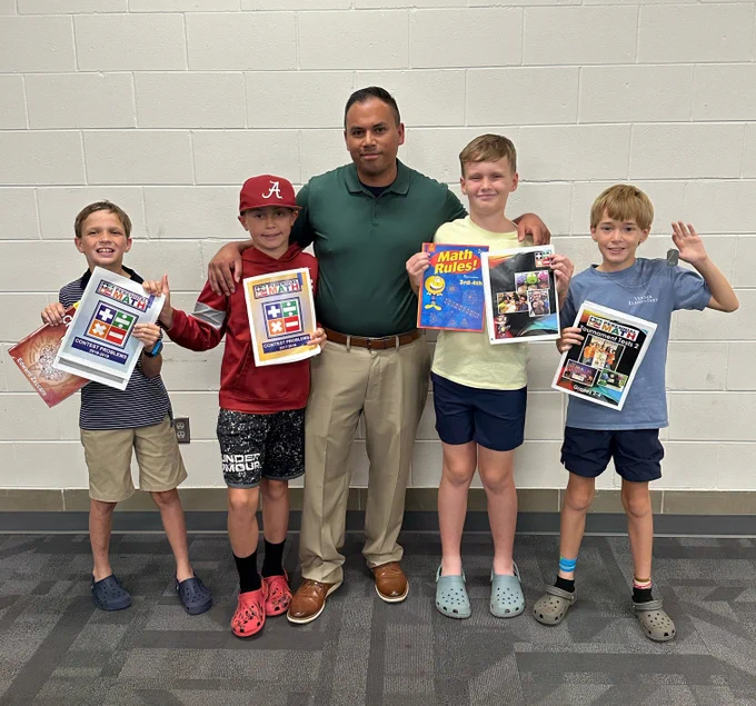 Verner Elementary math teacher Richard Williamson stands with four of his math students. The effort paid off with an impressive first-place finish in the team competition and a third-place finish in the individual competition.