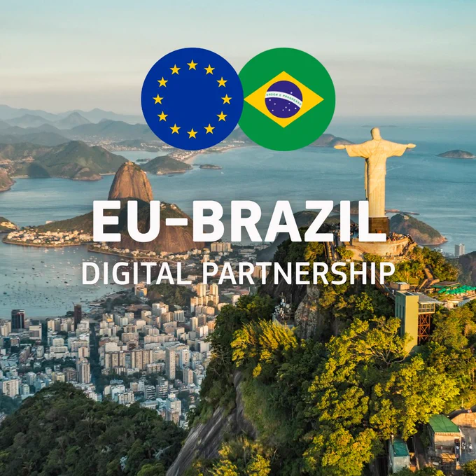 An aerial view of Rio de Janeiro, featuring the iconic Christ the Redeemer statue on the right, overlooking the city, mountains, and coastline. Superimposed in the center are two overlapping circular icons containing the European Union flag on the left and the Brazilian flag on the right. Below the flags, bold white text reads "EU-BRAZIL" followed by "DIGITAL PARTNERSHIP" in a slightly smaller font. 