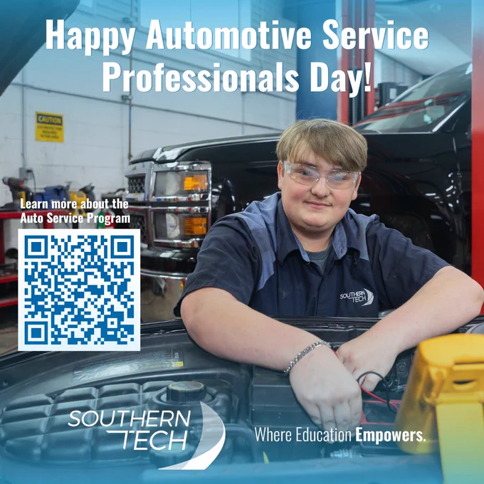 student working on a vehicle