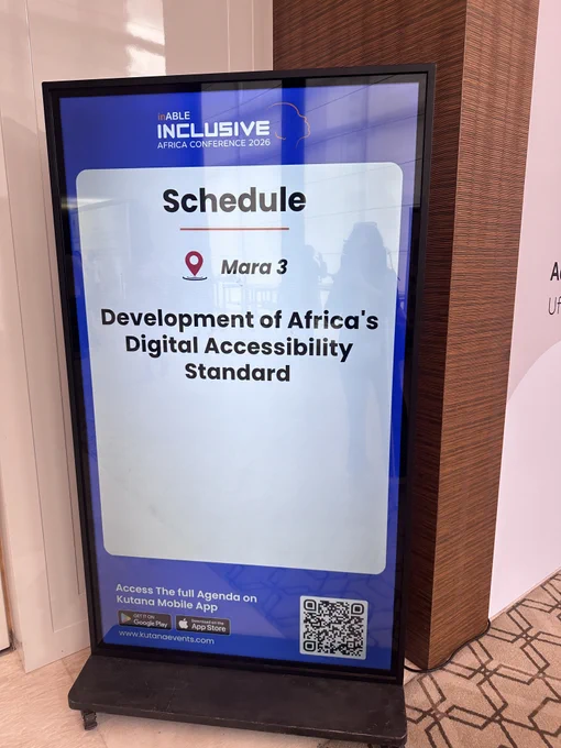 A sign outside the hall reads: schedule, mara 3, development of Africa's digital accessibility standard.