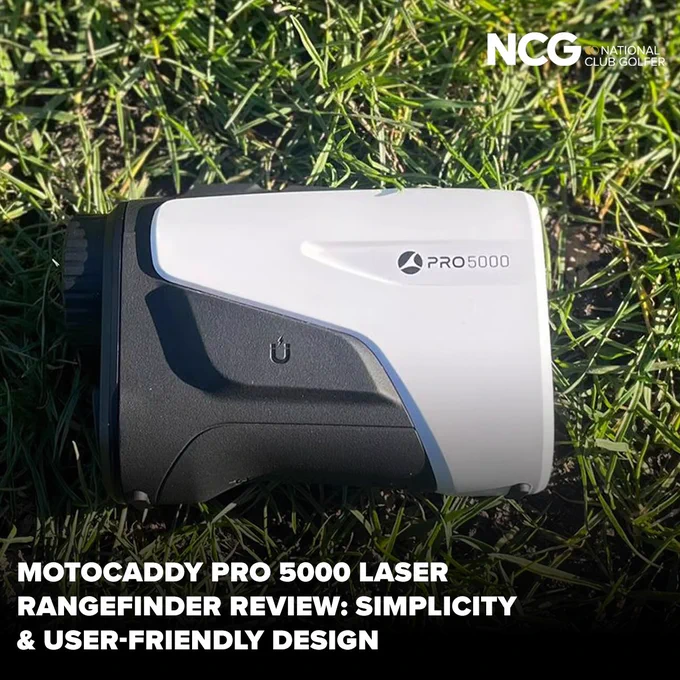 A detailed review image of the Motocaddy Pro 5000 laser rangefinder placed on grass. The image highlights simplicity and user-friendly design.