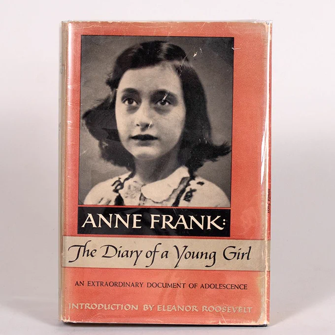 Photograph of the early English edition of Anne Frank's diary, which has a black and white photo of her on the cover. On this edition, Eleanor Roosevelt contributed an introduction.