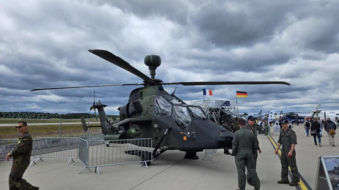 German airmen mill about a Tiger attack helicopter at the Berlin Air Show on June 12, 2026. (Breaking Defense)