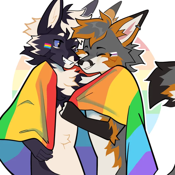 Wolf and Fox hugging in a pride blanket