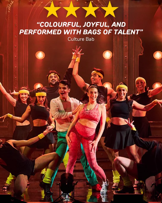 A group of performers energetically dancing on stage under bright lights, wearing colourful costumes with yellow headbands, and sweatbands. Above them, a four-star rating is displayed along with a review quote praising the show as "Colourful, joyful, and performed with bags of talent," attributed to Culture Bab.