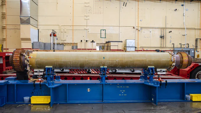 the magnet bundle, which looks like a large, long tube laying horizontally