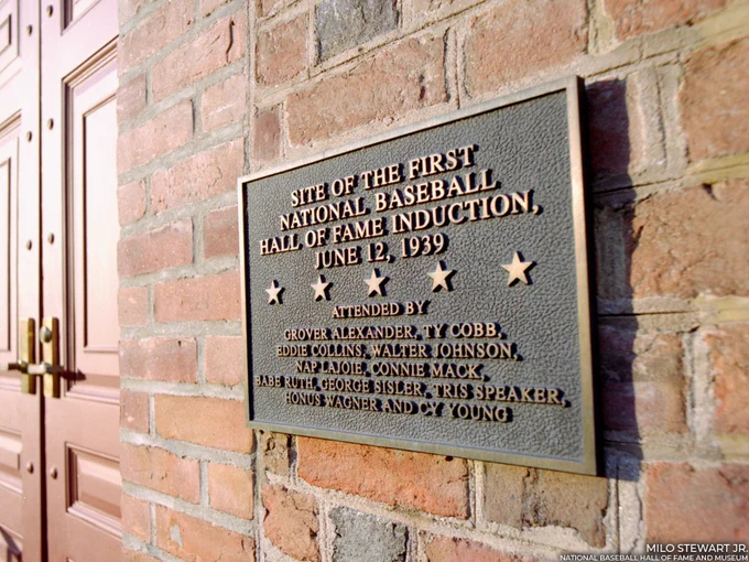 Plaque on the exterior of the Hall of Fame and Museum reads as follows:

SITE OF THE FIRST NATIONAL BASEBALL HALL OF FAME INDUCTION, JUNE 12, 1939

ATTENDED BY GROVER CLEVELAND, TY COBB, EDDIE COLLINS, WALTER JOHNSON, NAP LAJOIE, CONNIE MACK, BABE RUTH, GEORGE SISLER, TRIS SPEAKER, HONUS WAGNER AND CY YOUNG

Milo Stewart Jr./National Baseball Hall of Fame and Museum