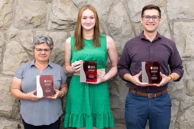 From left, Keri Busker, Emma Rice and Adam Runyan are the 2026 Education for Service award recipients.