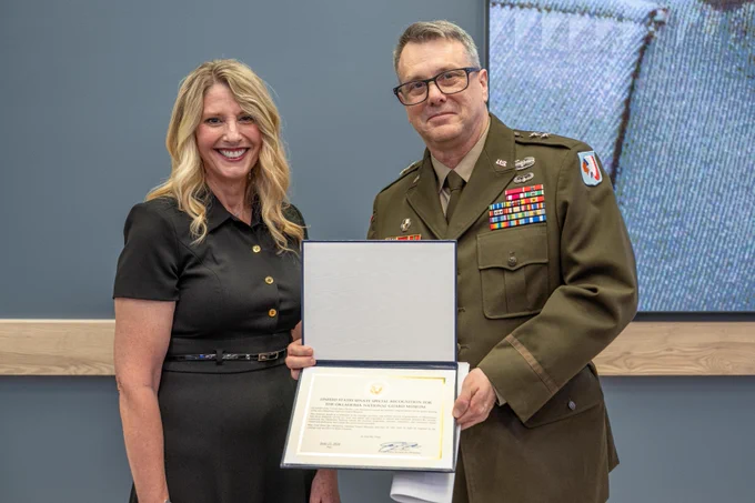 Mrs. Cindy Lankford, representing Senator James Lankford, presents Maj. Gen. Thomas H. Mancino with a US Senate special recognition honoring the Oklahoma National Guard Museum during a ribbon cutting ceremony for the Oklahoma National Guard Museum in Oklahoma City, June 11, 2026. (Oklahoma National Guard photo by Anthony Jones)