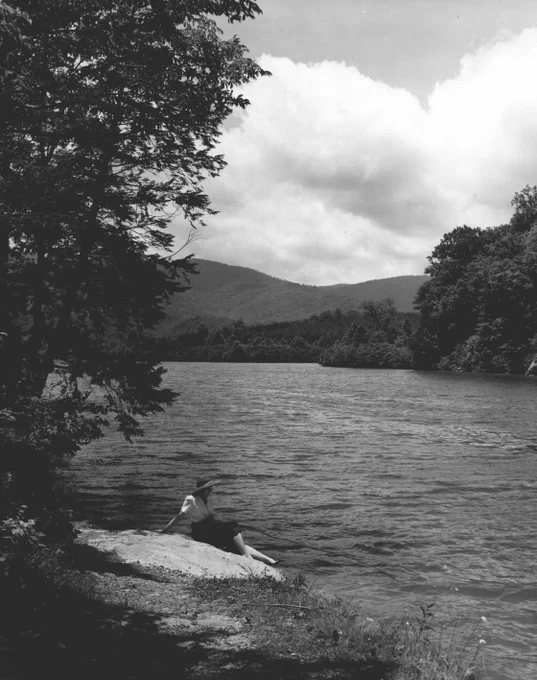 A young woman cane pole fishing from the shore in Cove Lake State Park, June 1948. Courtesy of Tennessee State Library & Archives.