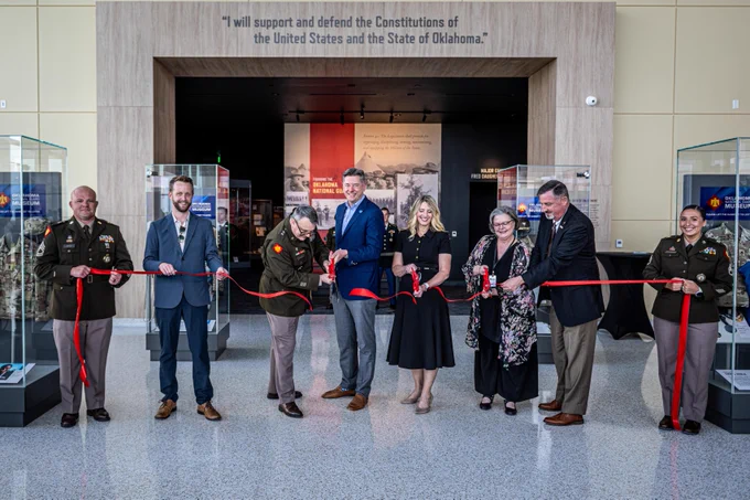 (Left to Right) Jay Fox, Hensel Phelps Construction; Maj. Gen. Thomas H. Mancino, adjutant general for Oklahoma, Mayor David Holt, mayor of Oklahoma City, Mrs. Cindy Lankford, representing Senator James Lankford; Dr. Denise Neil, Oklahoma National Guard Museum executive director, join in the ribbon cutting for the Oklahoma National Guard Museum in Oklahoma City, June 11, 2026. (Oklahoma National Guard photo by Anthony Jones)\n