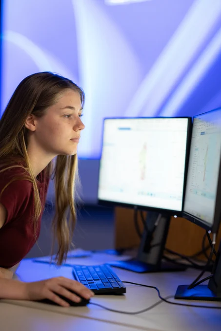 Student sitting at desktop computer