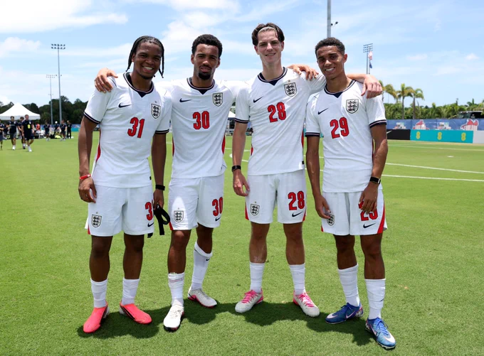 Alex Scott, Ethan Nwaneri, Rio Ngumoha and Josh King pose for a photo together in England kit.