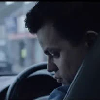 Image of a driver being distracted.  