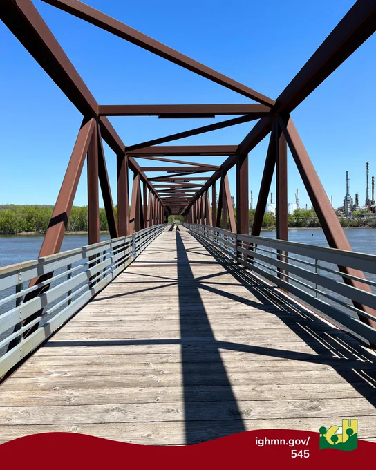 Historic Rock Island Swing Bridge on a clear blue sky day over the Mississippi.