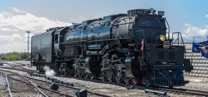 Union Pacific Big Boy stopped under a partly cloudy sky.