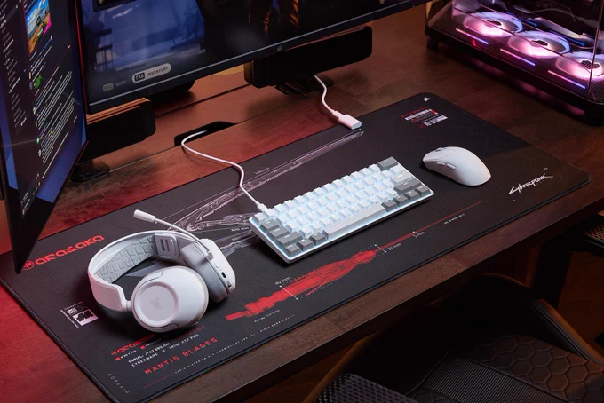 An image of a white HS35 v3 headset, a white CLIPPER PRO MINI 60 keybioard, and a white SABRE mouse.  They are on a dark, contrasting colored mousemat.