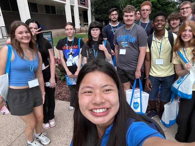 SOA takes selfie with students at orientation
