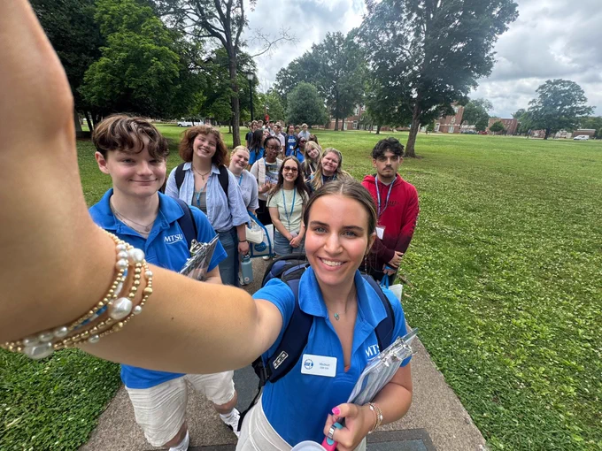 SOA takes selfie with students at orientation