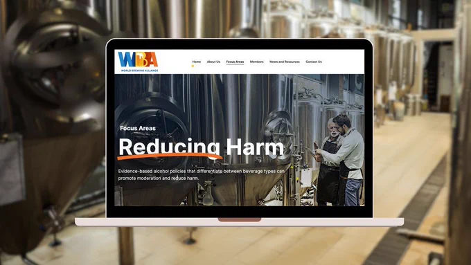 Screenshot of the World Brewing Alliance's website. Two men are standing in a brewery. Text says "Reducing Harm. Evidence-based alcohol policies that differentiate between beverage types can promote moderation and reduce harm."