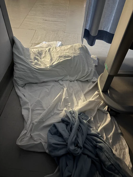 Sheet and pillow on a hospital ward floor