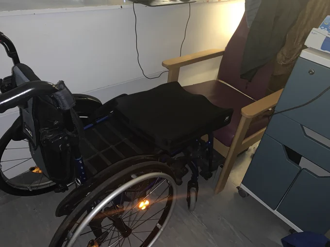 Cobbling together a bed from hard upright chair and sons wheelchair while caring for him in hospital on an adult ward