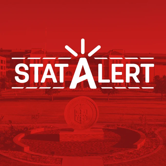 Red alert banner reading STAT ALERT with white alarm icon and dashed lines over a faint university campus background.