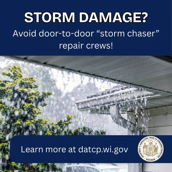 Heavy rain pouring off a house roof gutter during a storm with a tree in the background, warning against door-to-door storm repair crews.