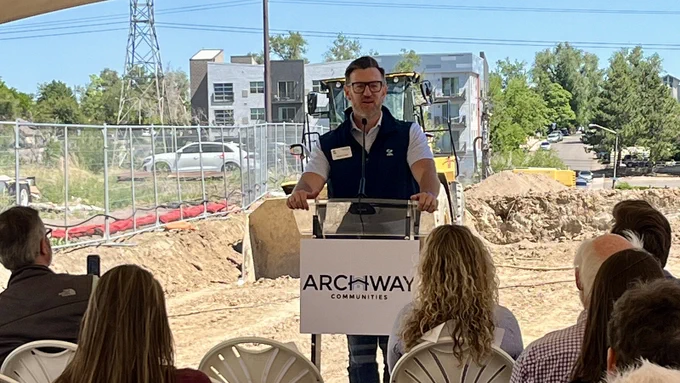 CHFA Executive Director and CEO, Thomas Bryan speaking outdoors at the Creekside Flats groundbreaking celebration.
