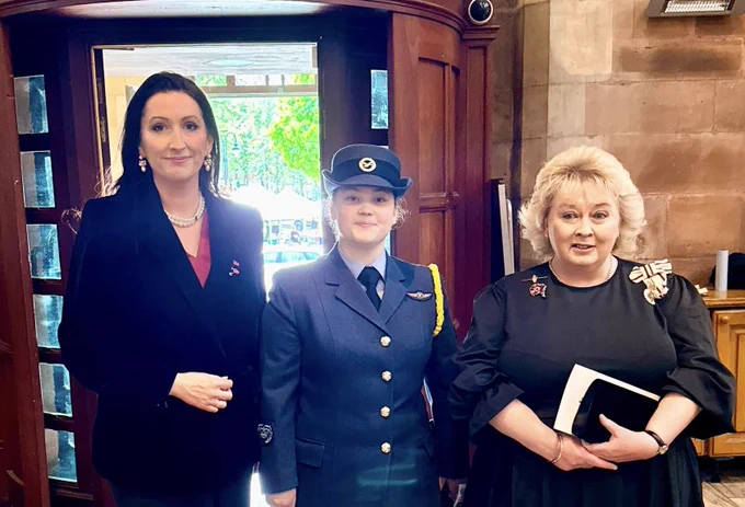 Image of three people - including deputy First Minister Emma Little-Pengelly - at entrance to St Anne’s Cathedral