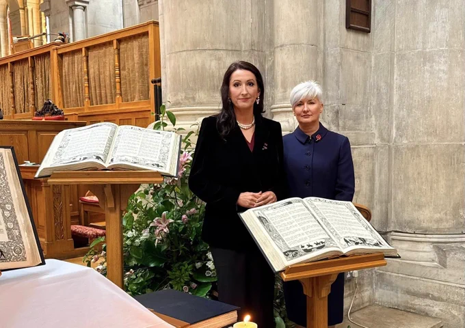 Image of two people - deputy First Minister Emma Little-Pengelly and Junior Minister Joanne Bunting at St Anne’s Cathedral. Lectern in foreground and lectern in background.