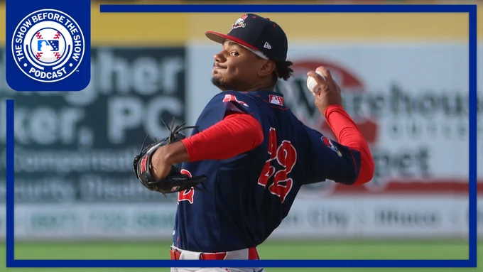Anthony Eyanson delivers a pitch in a blue Portland Sea Dogs uniform.