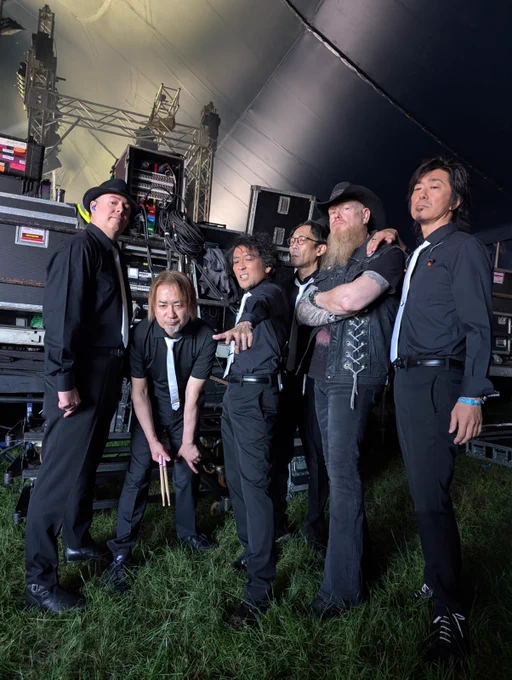 A photograph of The Primals posing together before the show.