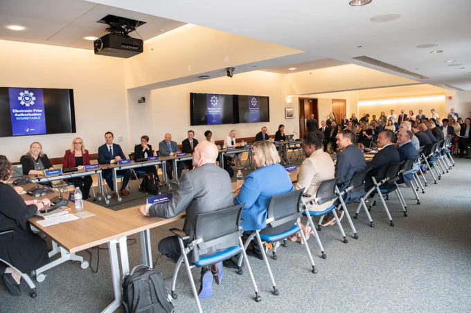 Group of healthcare experts gather around a table for a discussion