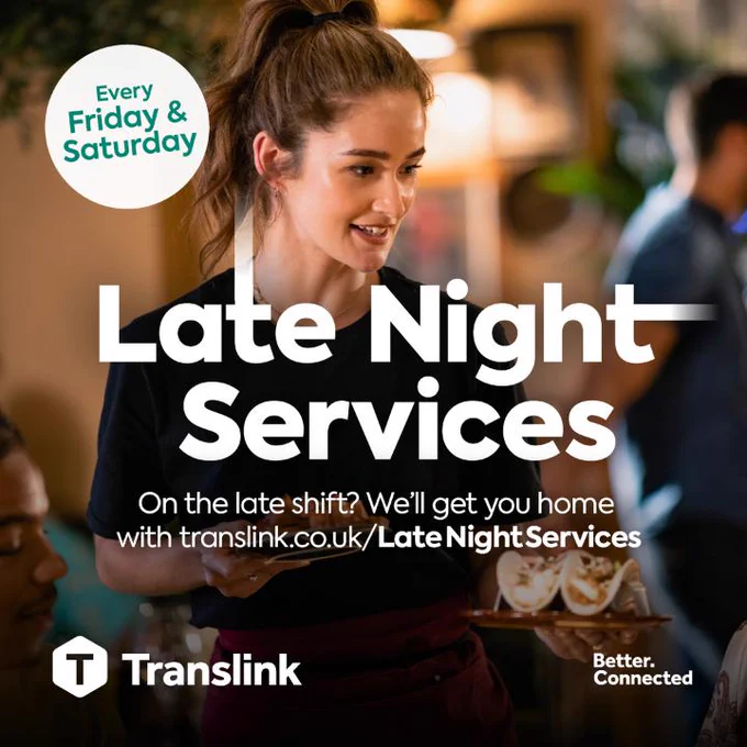 A smiling waitress carries plates of food in a restaurant alongside text promoting Translink\u2019s late night services available every Friday and Saturday.