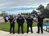 Deputies watch the ceremony from the back of the gathering