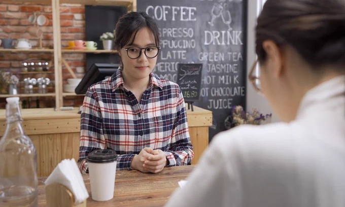 Young woman being interviewed for a job.