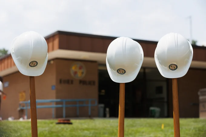 Photo of shovels and hard hats outside the precinct.